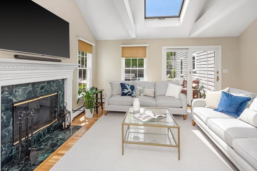 60 Old County Road Hingham, MA 02043 - Photo 7 of 32 a living room with furniture and a fireplace
