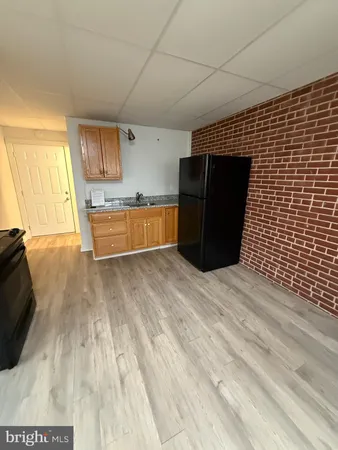 a view of a kitchen with wooden floor