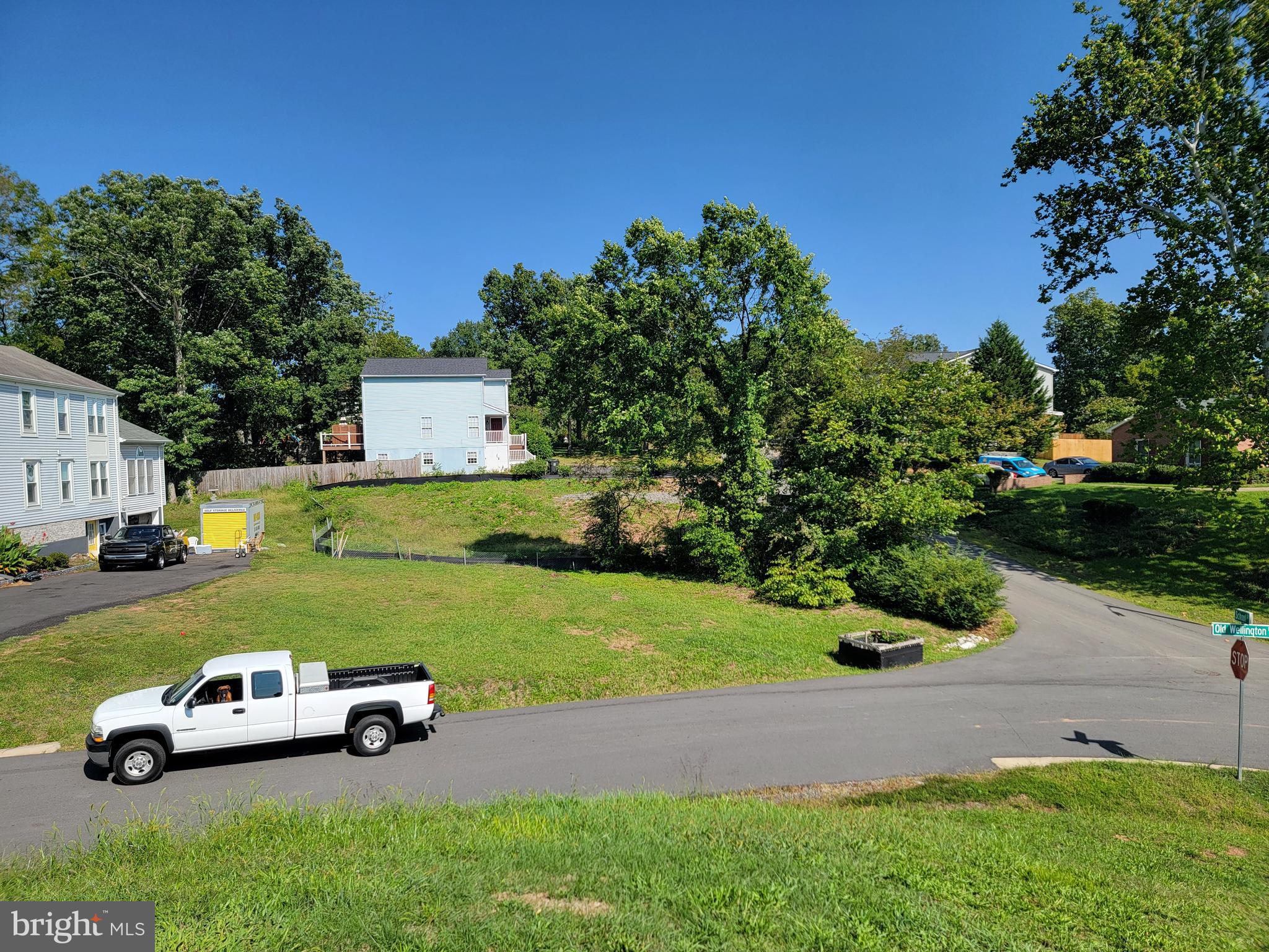a car parked in the middle of a grassy field