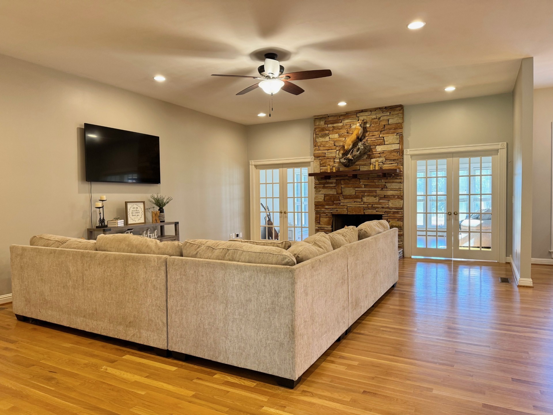 399 Edgar Meeks Road Burns, TN 37029 - Photo 12 of 28 a living room with furniture and a flat screen tv