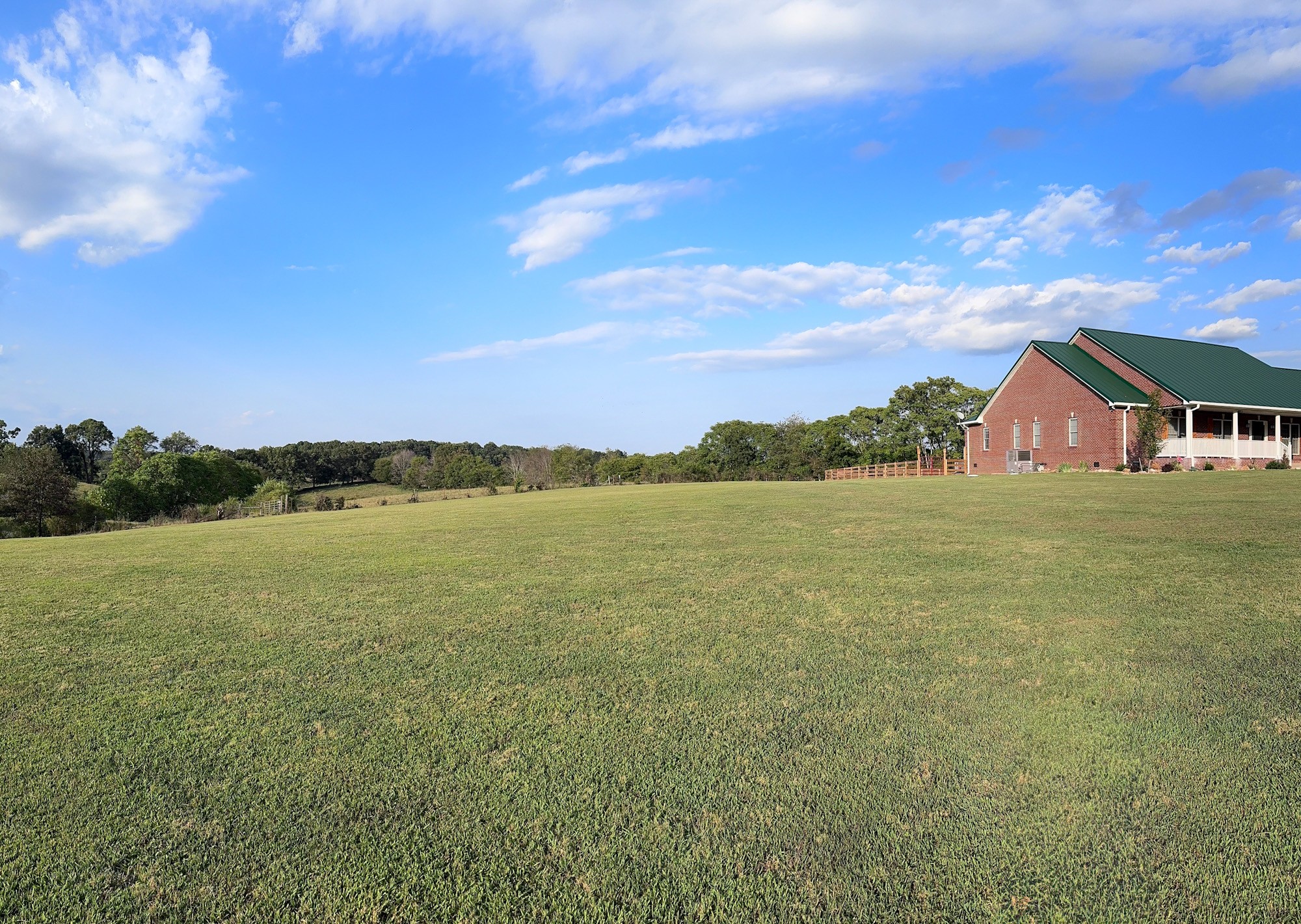 399 Edgar Meeks Road Burns, TN 37029 - Photo 3 of 28 a view of a lake and a yard