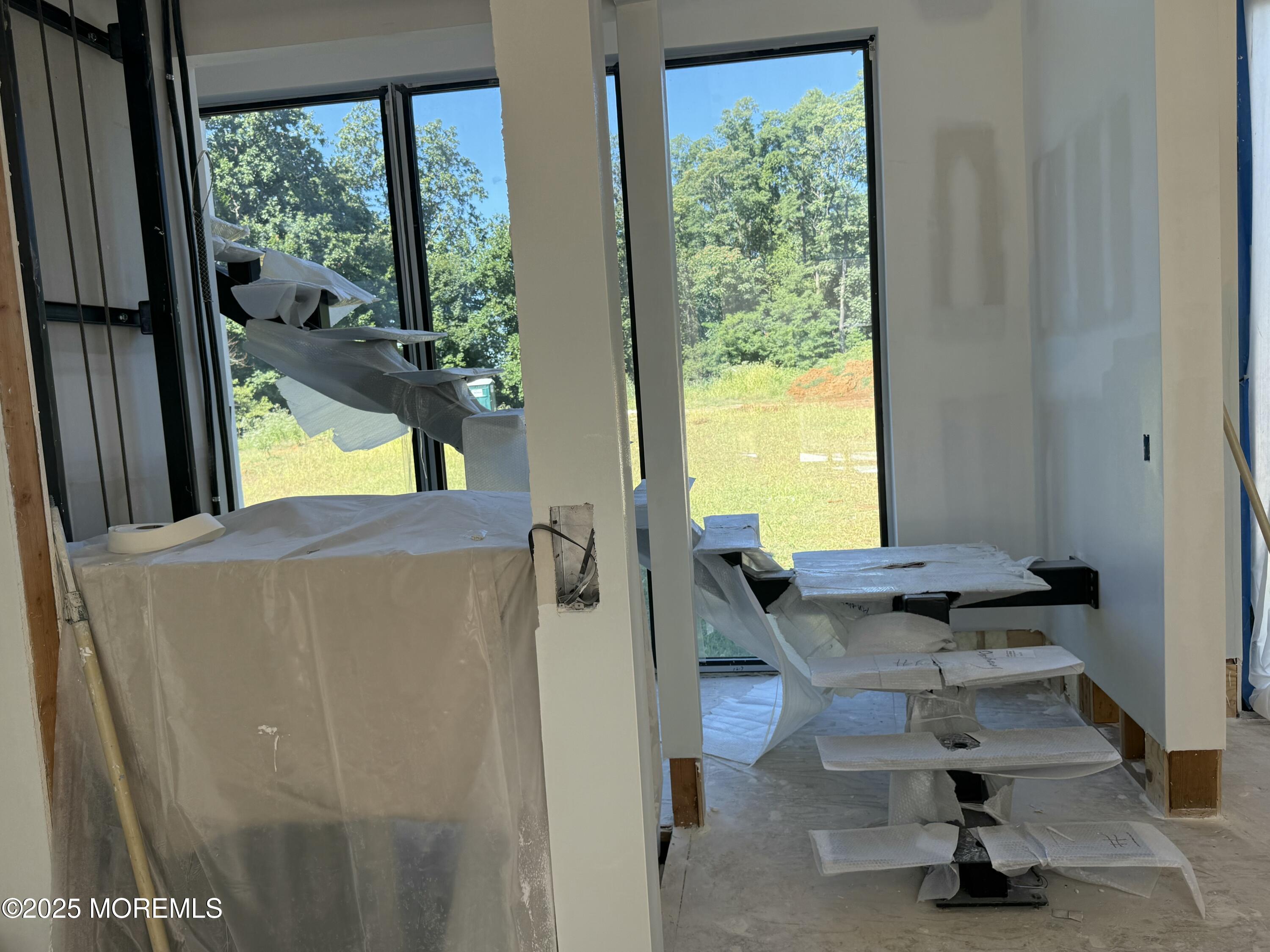 798 Holmdel Road Holmdel, NJ 07733 - Photo 16 of 19 a view of a floor to ceiling window and a kitchen