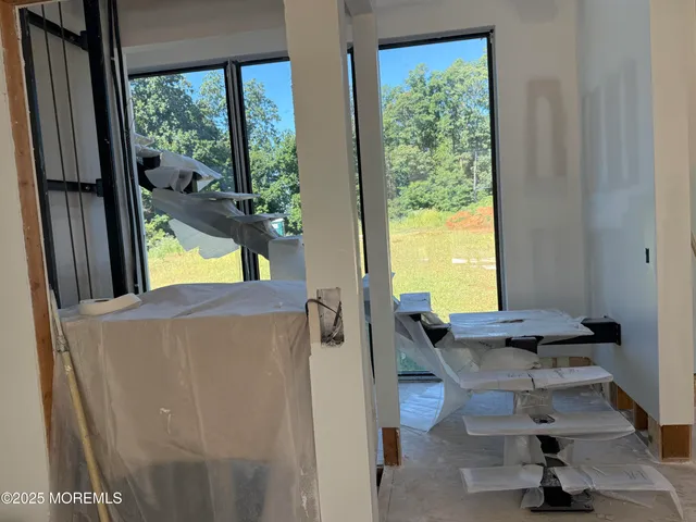 a view of living room with furniture and a window
