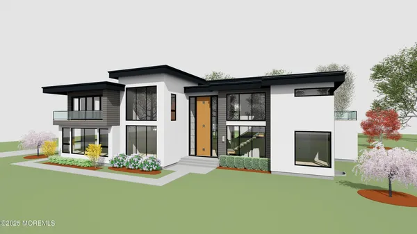 a front view of a house with a yard garage and outdoor seating