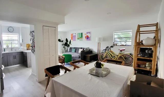 a bedroom with furniture and a window