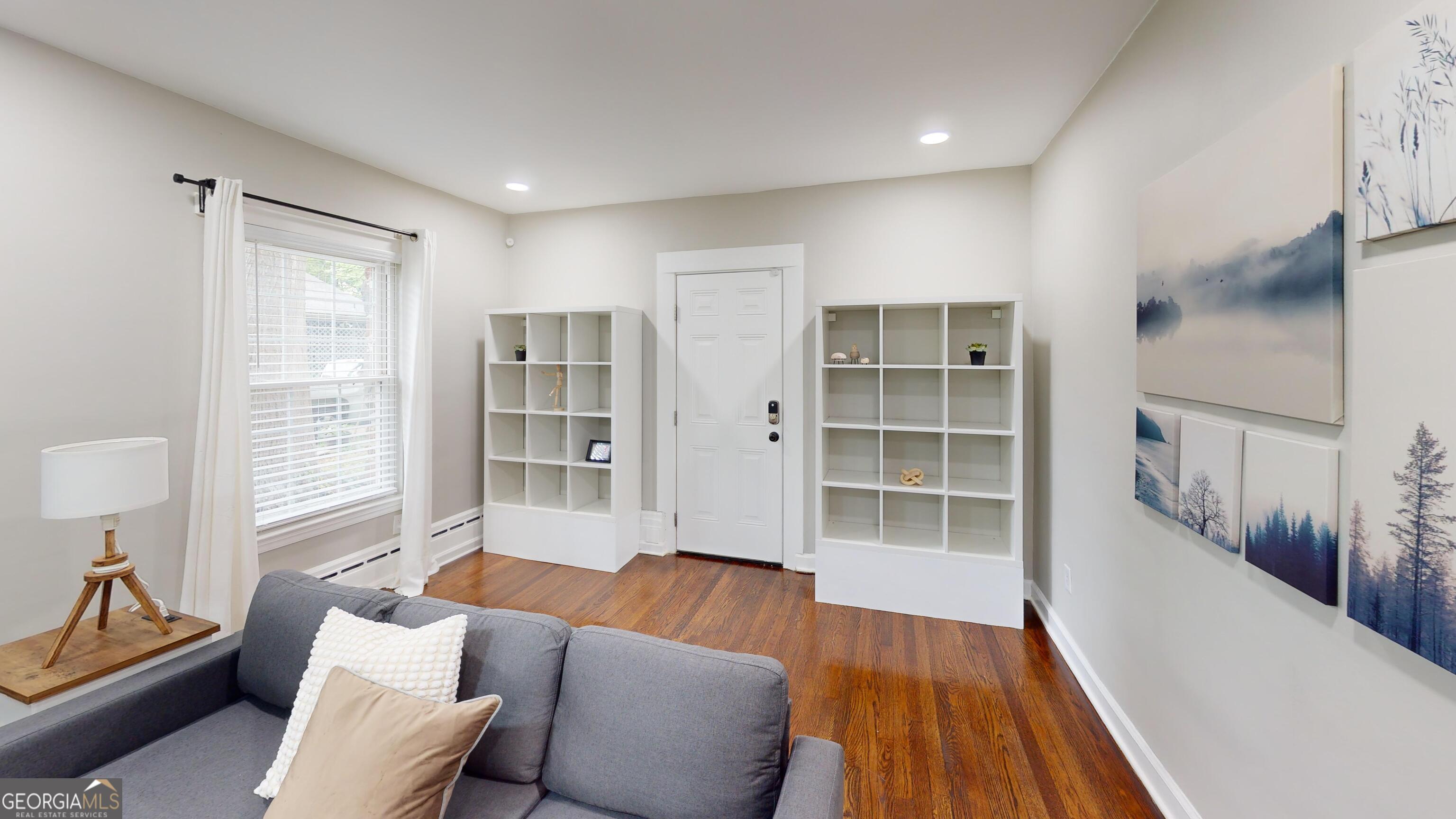 1114 Fayetteville Road Southeast Atlanta, GA 30316 - Photo 17 of 26 a living room with furniture and a flat screen tv