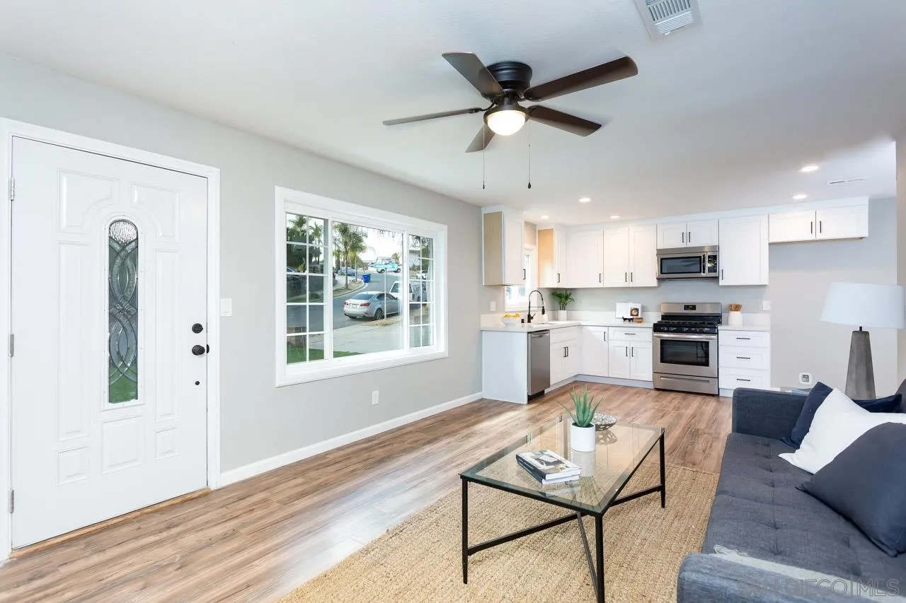 9597 Mandeville Road Santee, CA 92071 - Photo 14 of 32 a living room with stainless steel appliances kitchen island furniture and a window