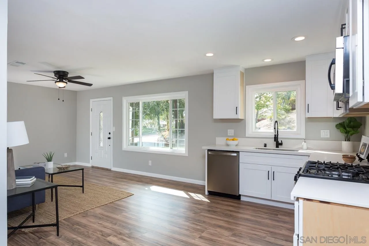 9597 Mandeville Road Santee, CA 92071 - Photo 17 of 32 a kitchen with a sink appliances cabinets and a window