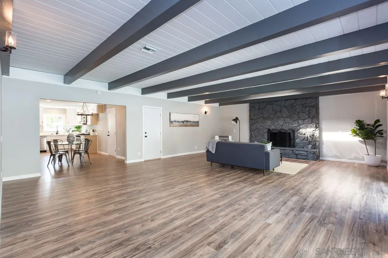 9597 Mandeville Road Santee, CA 92071 - Photo 3 of 32 a view of livingroom with furniture and wooden floor