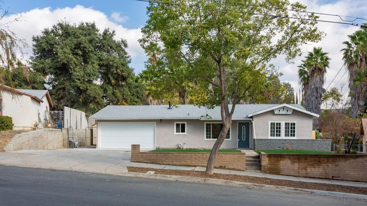 9597 Mandeville Road Santee, CA 92071 - Photo 31 of 32 a front view of a house with a yard and garage