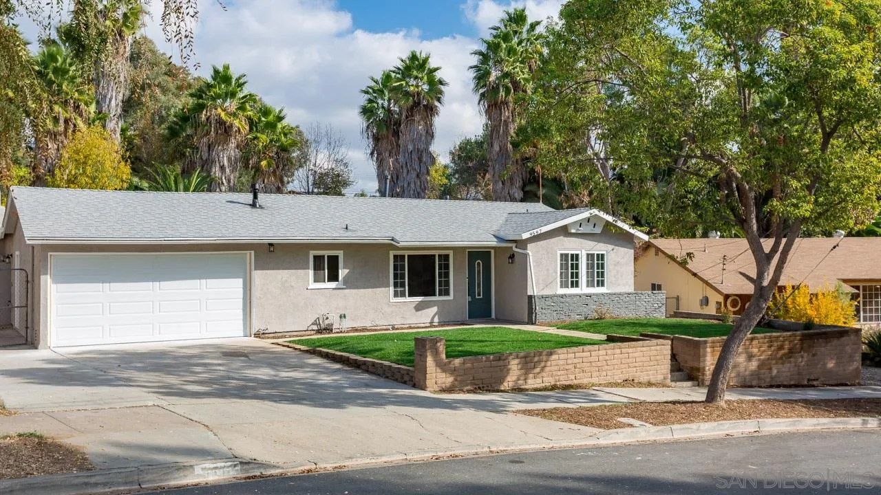 9597 Mandeville Road Santee, CA 92071 - Photo 32 of 32 a front view of a house with a yard and garage