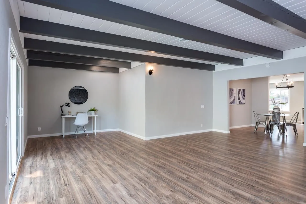 9597 Mandeville Road Santee, CA 92071 - Photo 7 of 32 a view of empty room with wooden floor and furniture