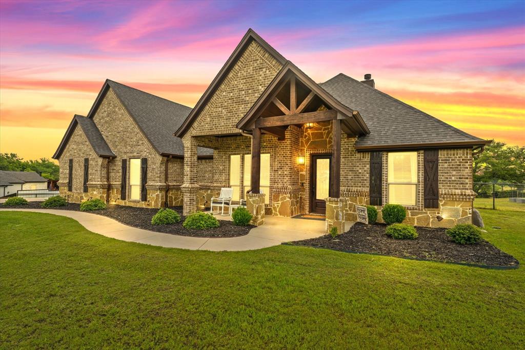 3236 North Cardinal Road Azle, TX 76020 - Photo 1 of 1 View of front of property with brick siding, a shingled roof, a chimney, and a patio area