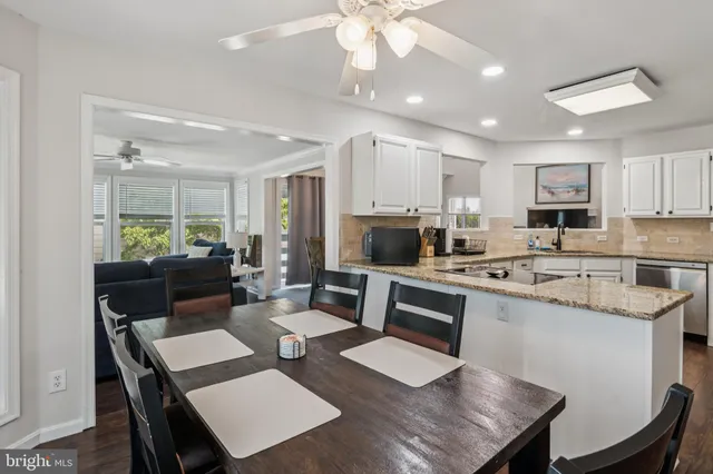 a utility room with cabinets dryer and washer