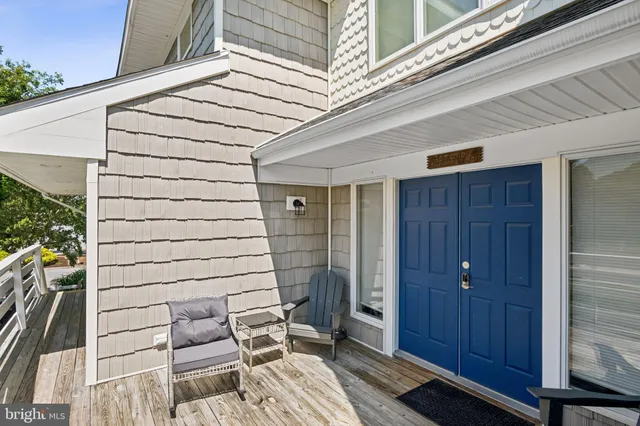 a view of a living room and entry way