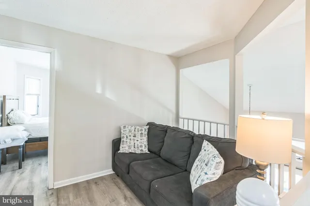 a bedroom with a bed and a fireplace