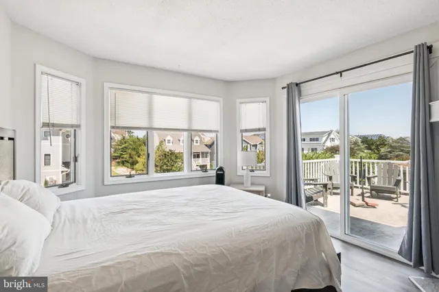 a hotel room with a bed and a flat screen tv