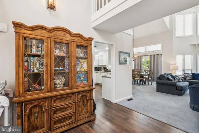 a living room with furniture a ceiling fan and a rug
