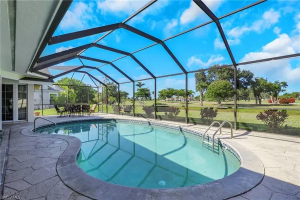 a view of a swimming pool with a porch