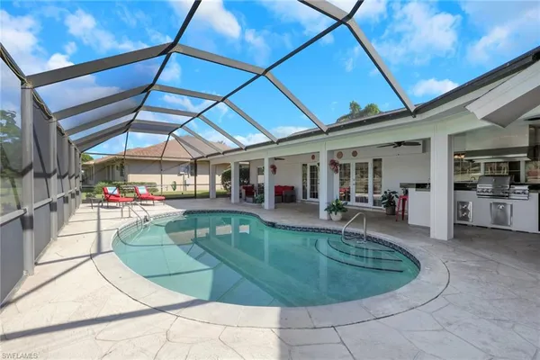 a view of a swimming pool with sitting area