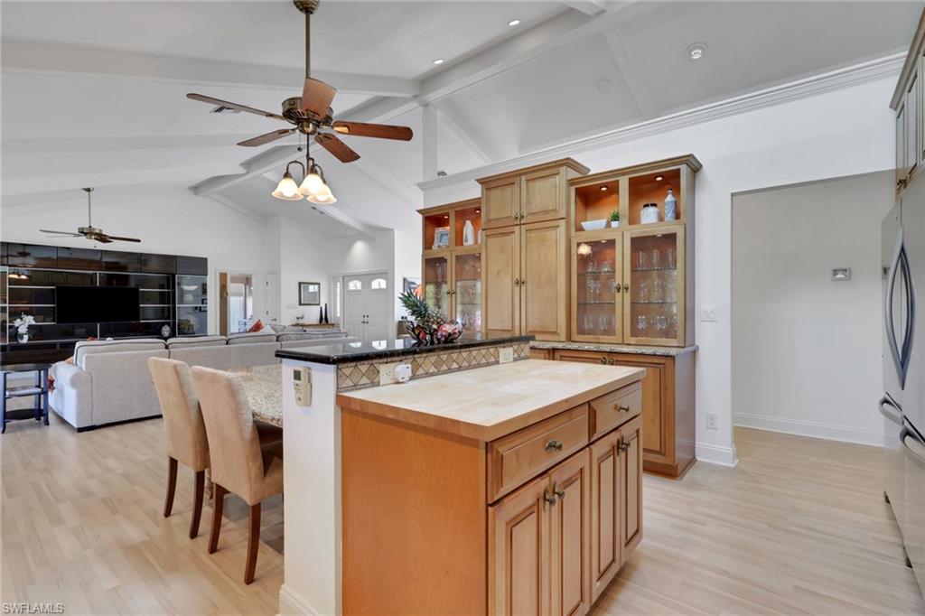 369 Hidden Valley Drive Naples, FL 34113 - Photo 18 of 49 a kitchen that has a table and chairs in it