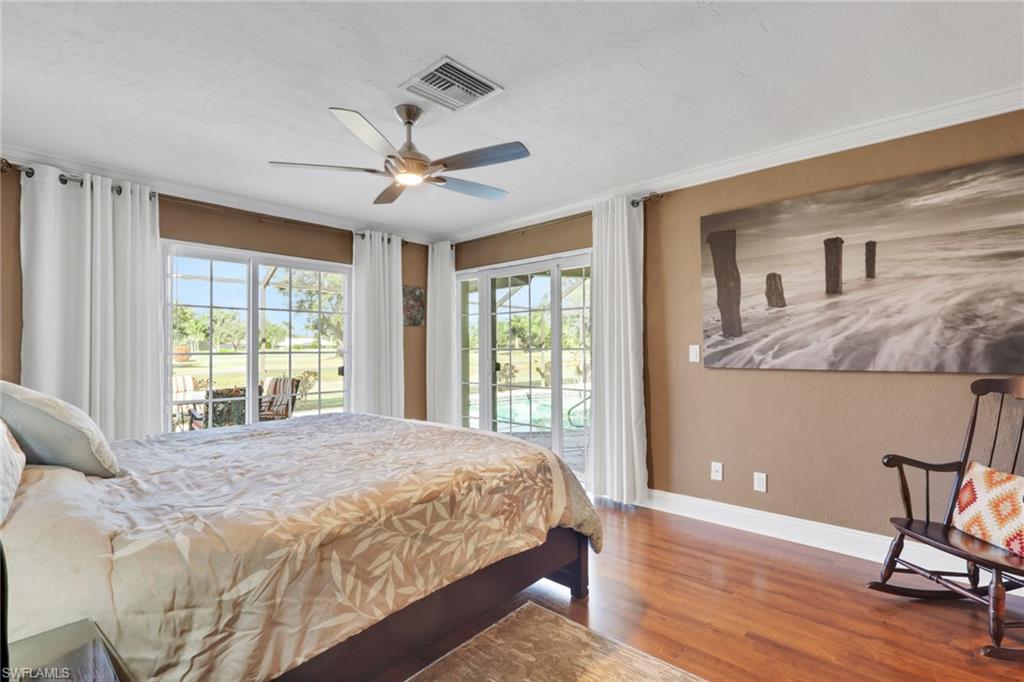 369 Hidden Valley Drive Naples, FL 34113 - Photo 30 of 49 a bedroom with a bed and a window