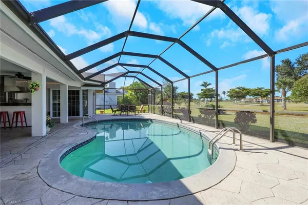 a view of a swimming pool with a patio