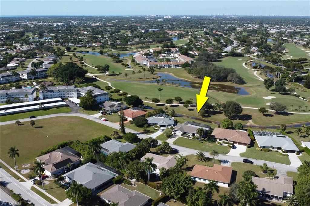 369 Hidden Valley Drive Naples, FL 34113 - Photo 40 of 49 an aerial view of residential houses with outdoor space