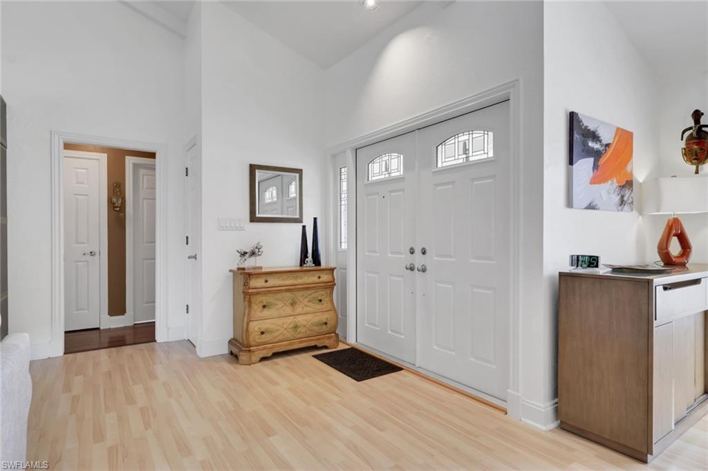 369 Hidden Valley Drive Naples, FL 34113 - Photo 4 of 49 a view of a bedroom with closet and cabinet