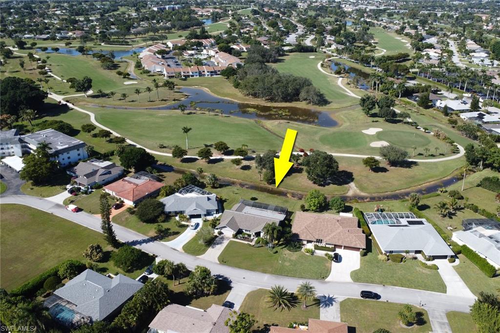 369 Hidden Valley Drive Naples, FL 34113 - Photo 41 of 49 an aerial view of a residential houses with outdoor space