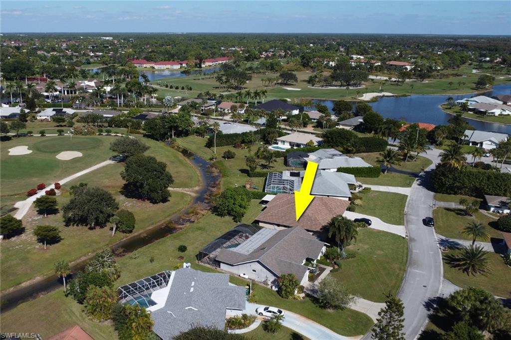 369 Hidden Valley Drive Naples, FL 34113 - Photo 46 of 49 an aerial view of a houses with a swimming pool