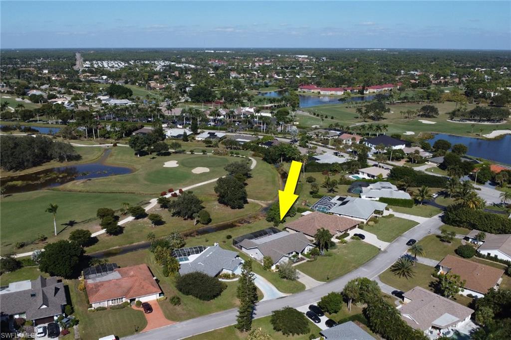 369 Hidden Valley Drive Naples, FL 34113 - Photo 47 of 49 an aerial view of a houses with a swimming pool