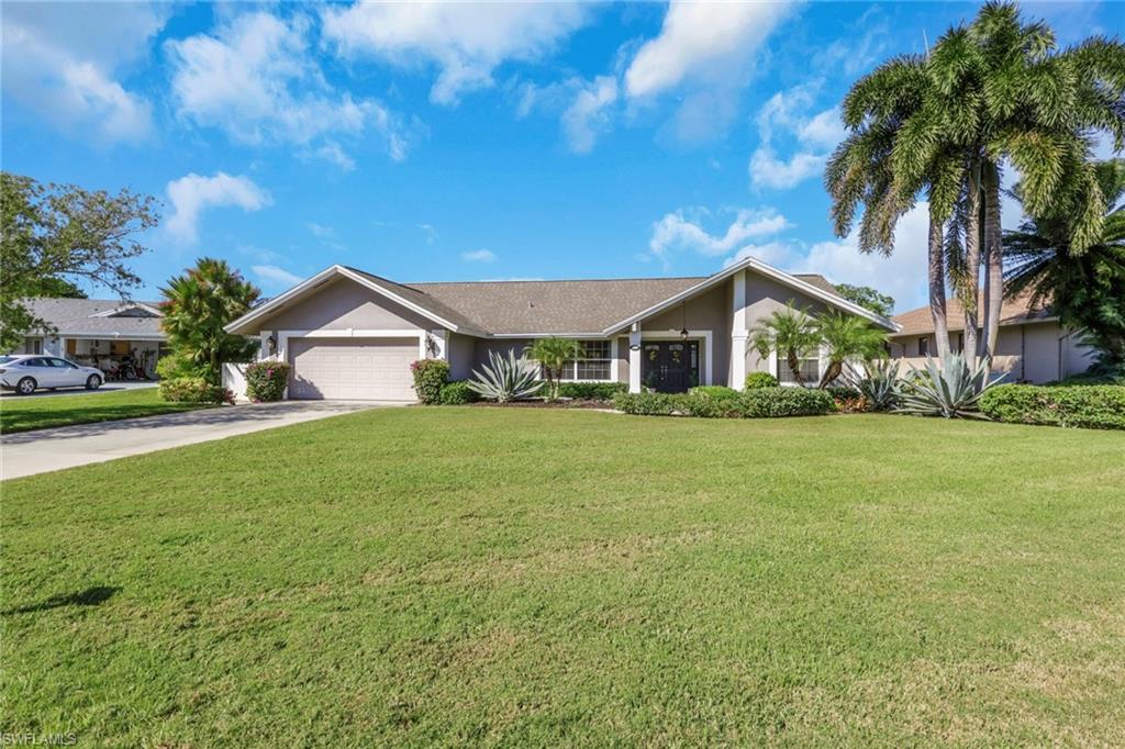 369 Hidden Valley Drive Naples, FL 34113 - Photo 49 of 49 a front view of house with yard and green space