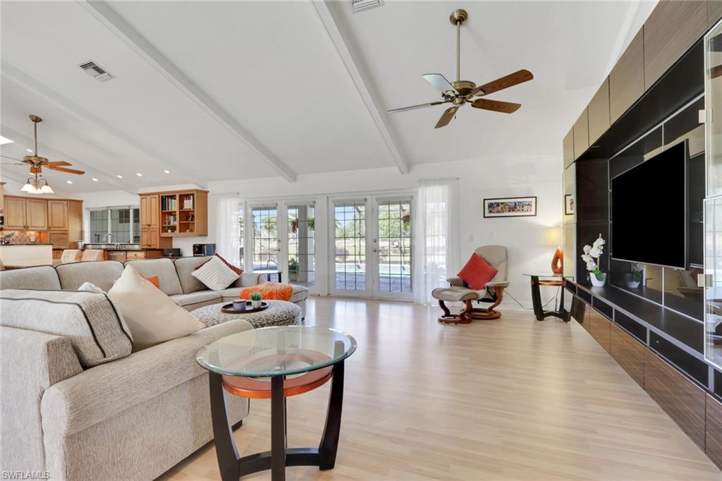 369 Hidden Valley Drive Naples, FL 34113 - Photo 9 of 49 a living room with furniture and a flat screen tv