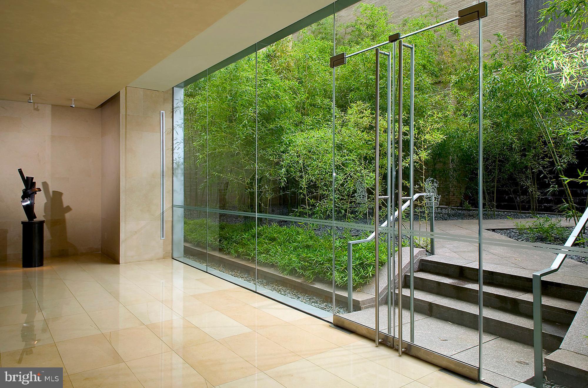 1111 23rd Street Northwest, Unit 4G Washington, DC 20037 - Photo 15 of 19 COURTYARD WATERFALL OFF OF LOBBY