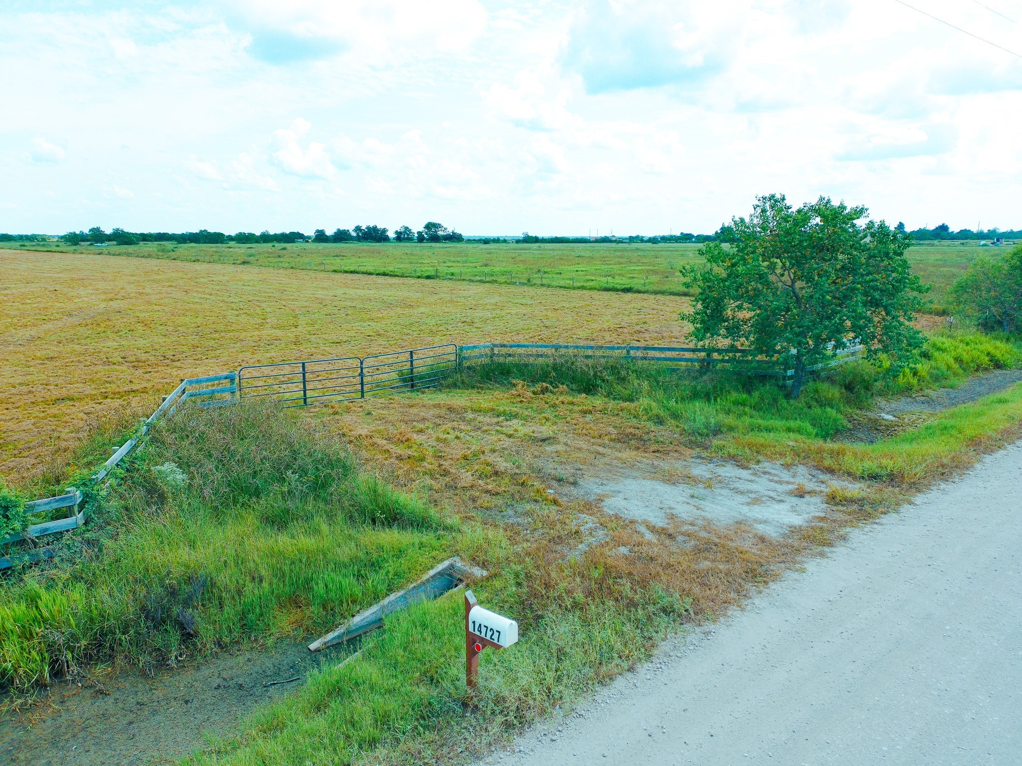 14727 Wolfgang Road Guy, TX 77444 - Photo 1 of 9 a view of a lake with a big yard