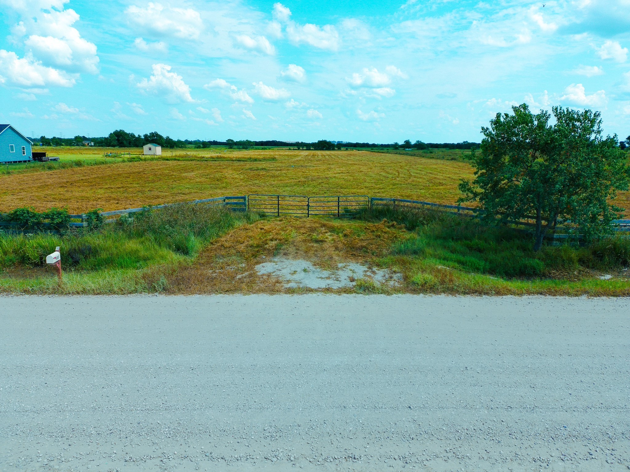 14727 Wolfgang Road Guy, TX 77444 - Photo 3 of 9 a view of a lake with a big yard
