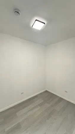 wooden floor and white walls