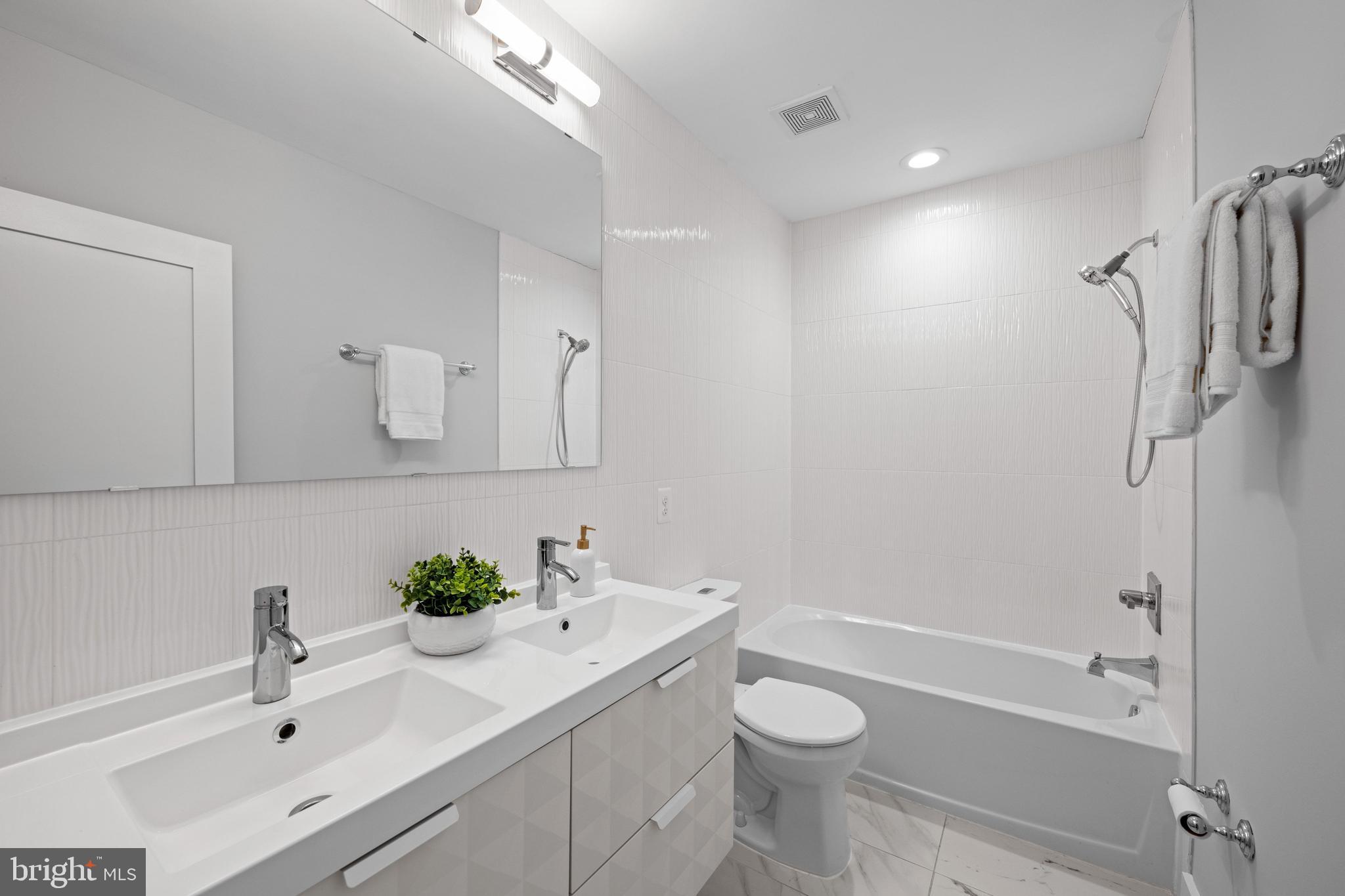 1124 4th Street Northeast Washington, DC 20002 - Photo 19 of 34 a bathroom with a sink toilet and shower