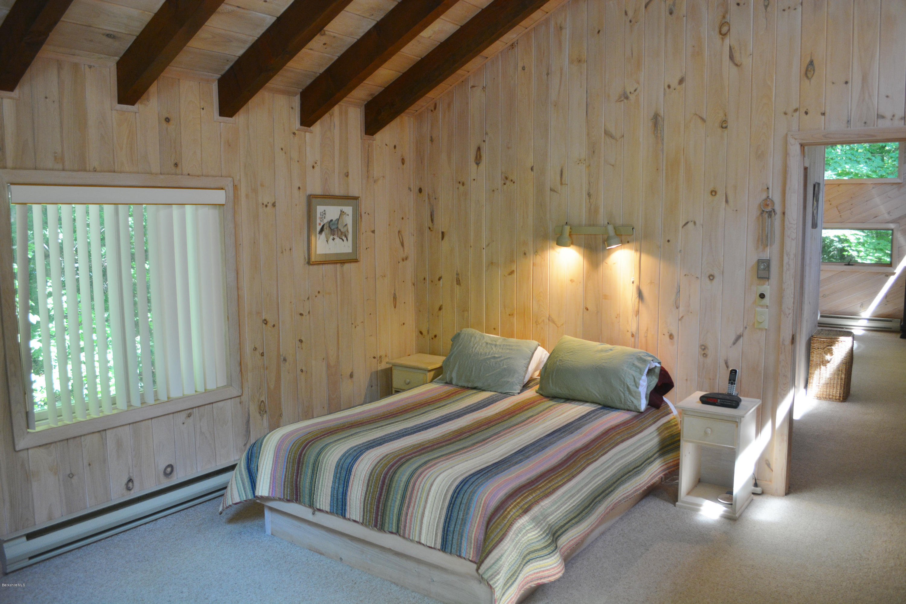 894 Moberg Road Becket, MA 01223 - Photo 13 of 21 a bedroom with a bed and a night stand