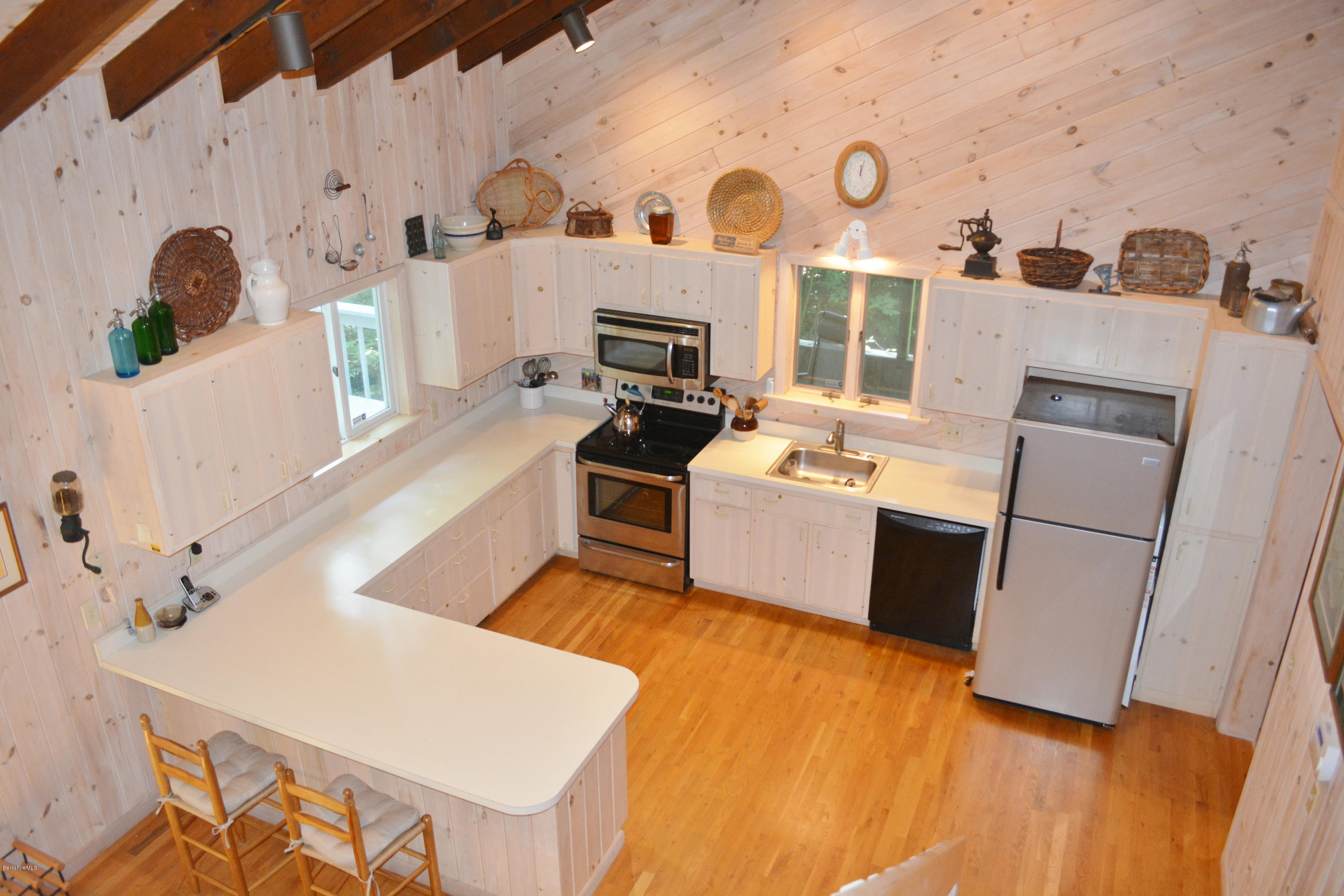 894 Moberg Road Becket, MA 01223 - Photo 4 of 21 a kitchen with a sink appliances and cabinets