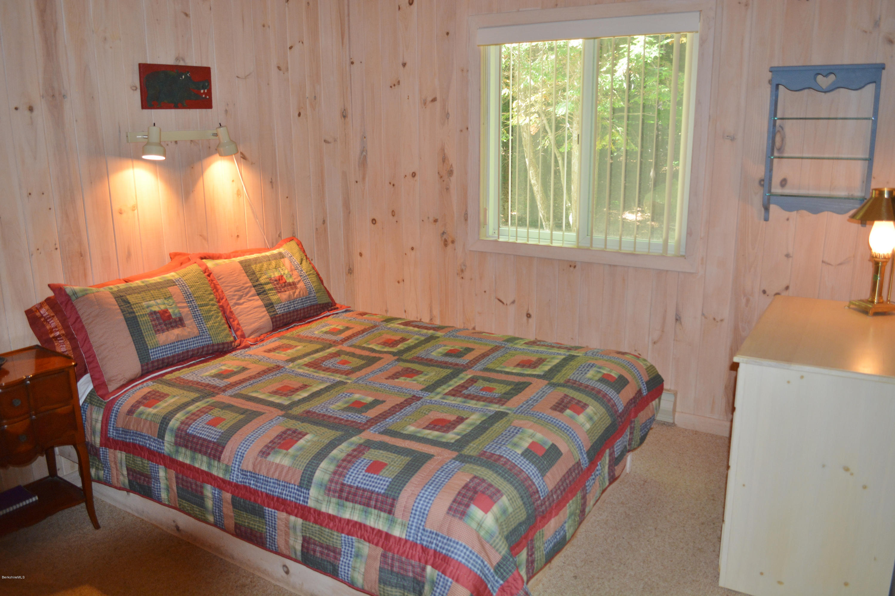 894 Moberg Road Becket, MA 01223 - Photo 9 of 21 a bedroom with a bed and a window