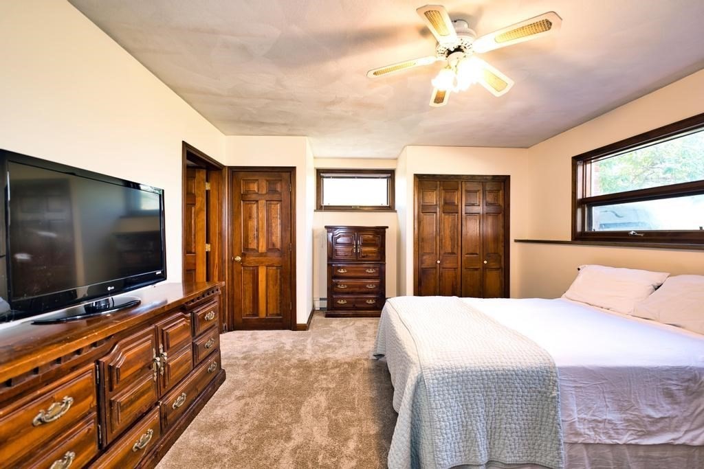 38 Gaudette Street Fall River, MA 02721 - Photo 40 of 41 a bedroom with a bed and a flat screen tv