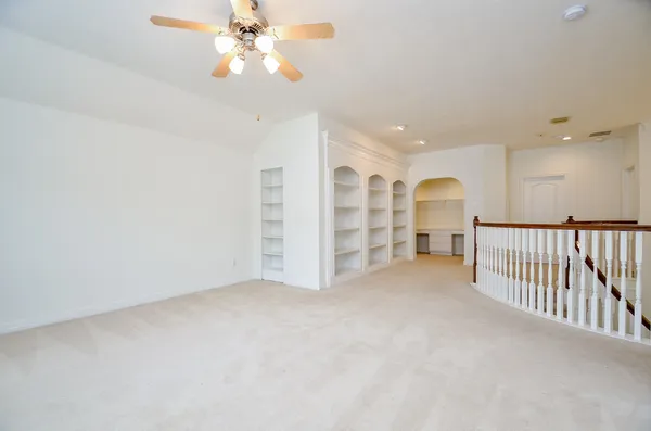 a bathroom with a sink toilet double vanity and shower