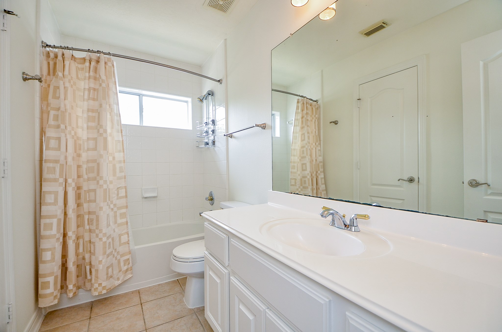 12522 Aliso Bend Lane Houston, TX 77041 - Photo 27 of 32 a bathroom with a sink toilet double vanity and shower