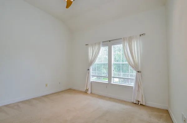 a white refrigerator freezer and a granite counter top