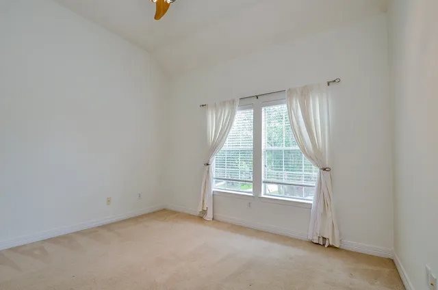 a white refrigerator freezer and a granite counter top