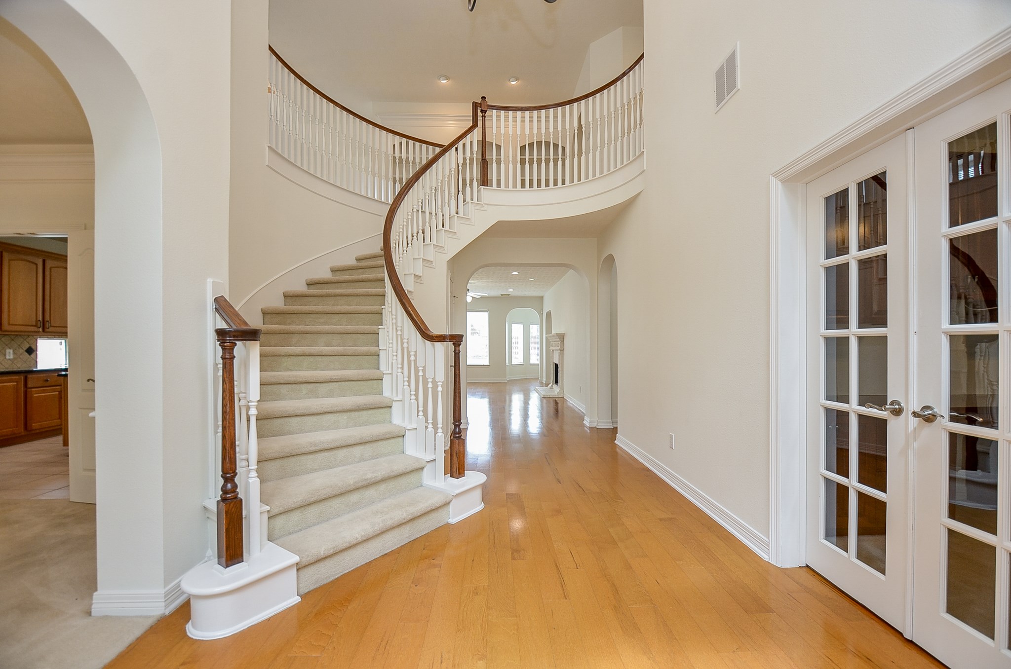 12522 Aliso Bend Lane Houston, TX 77041 - Photo 5 of 32 a view of staircase with white walls and a window