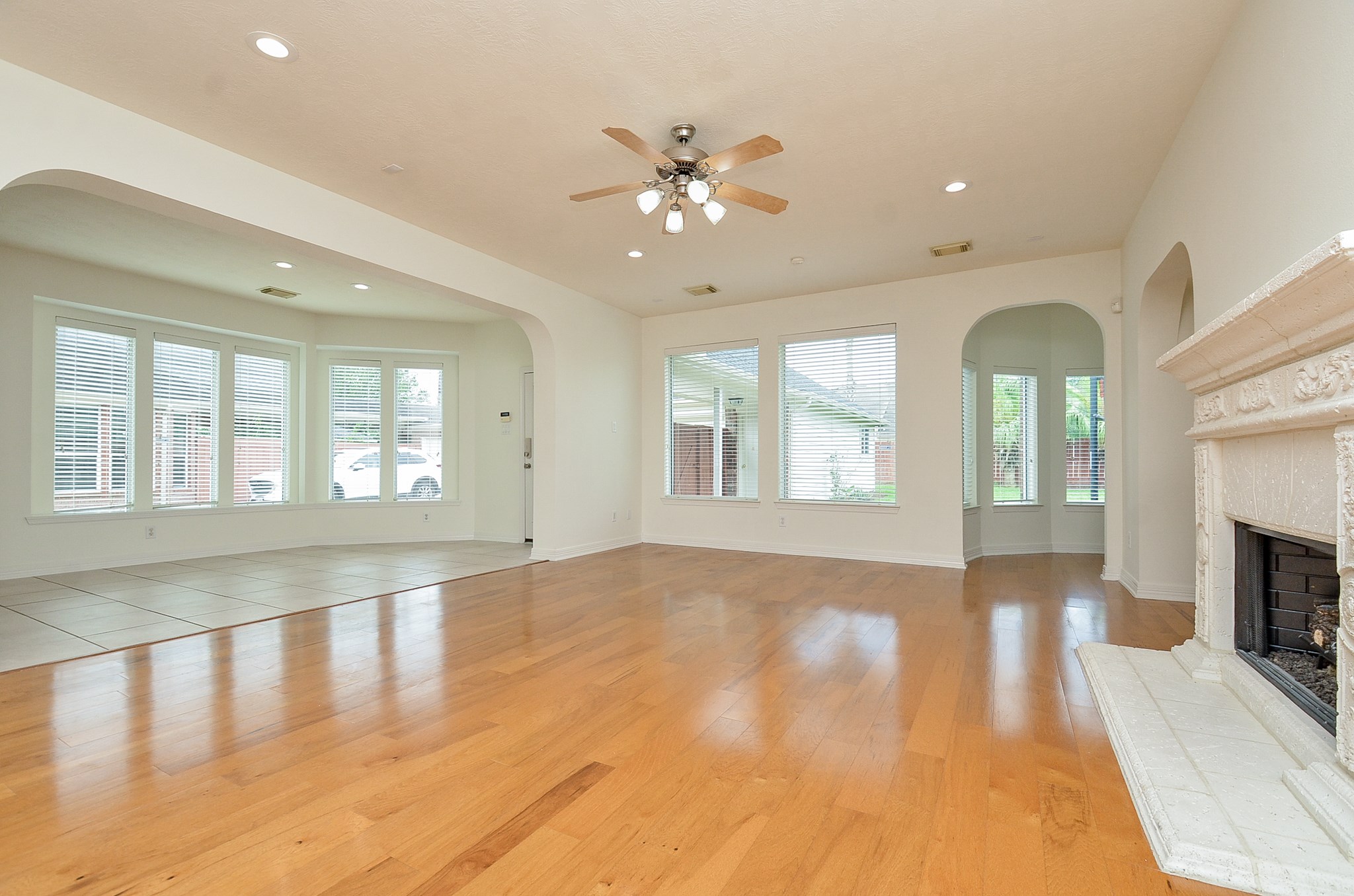 12522 Aliso Bend Lane Houston, TX 77041 - Photo 7 of 32 a view of an empty room with window and wooden floor