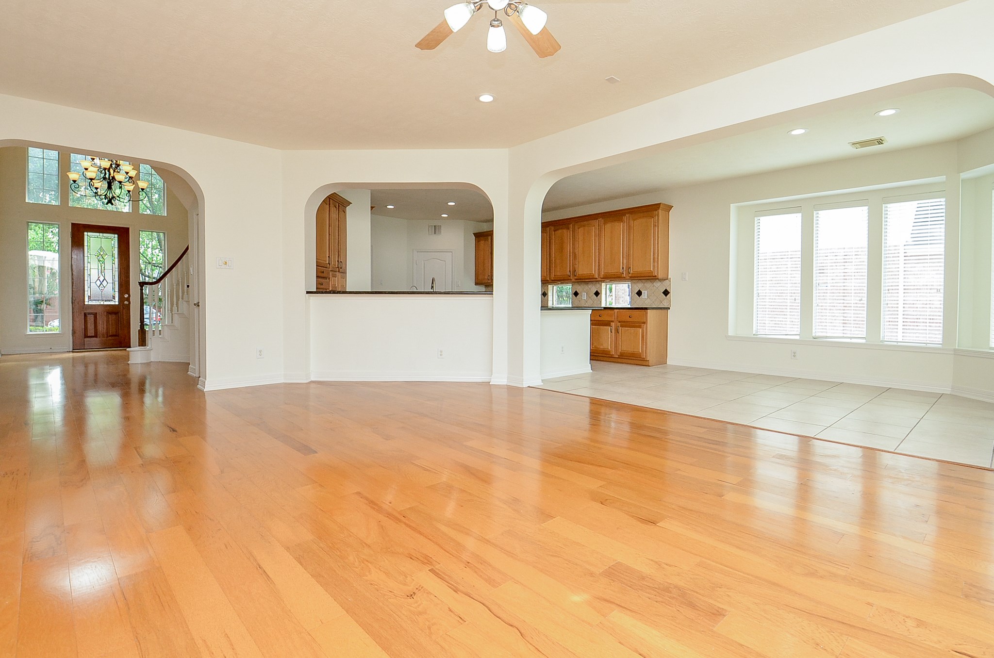 12522 Aliso Bend Lane Houston, TX 77041 - Photo 8 of 32 a view of an empty room with window and wooden floor
